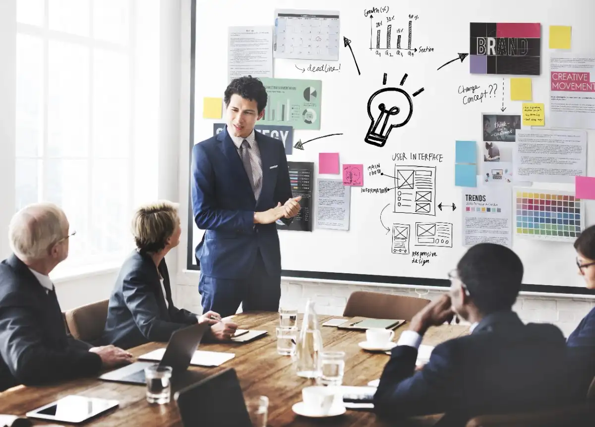 Professional team discussing project strategies during a PMP training session at a leading PMP training institute in Doha, Qatar