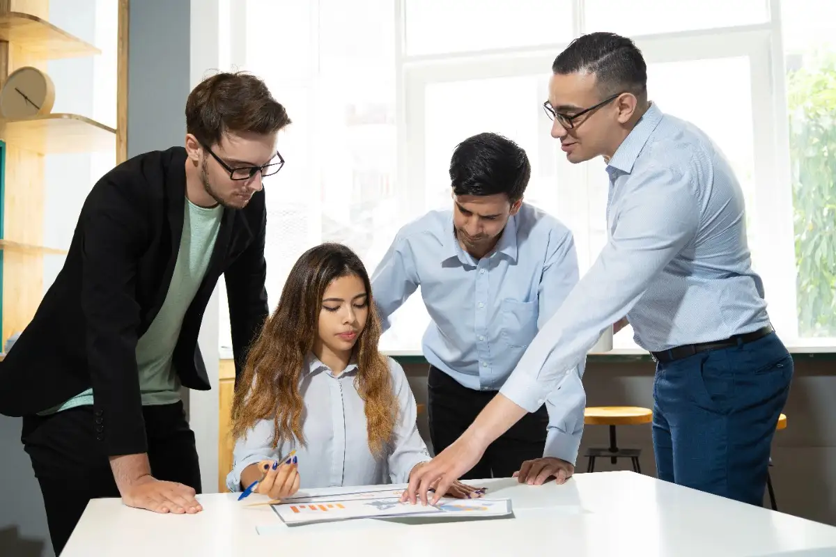 Professionals discussing project schedules during the Best AACEI PSP Certification training in Qatar.