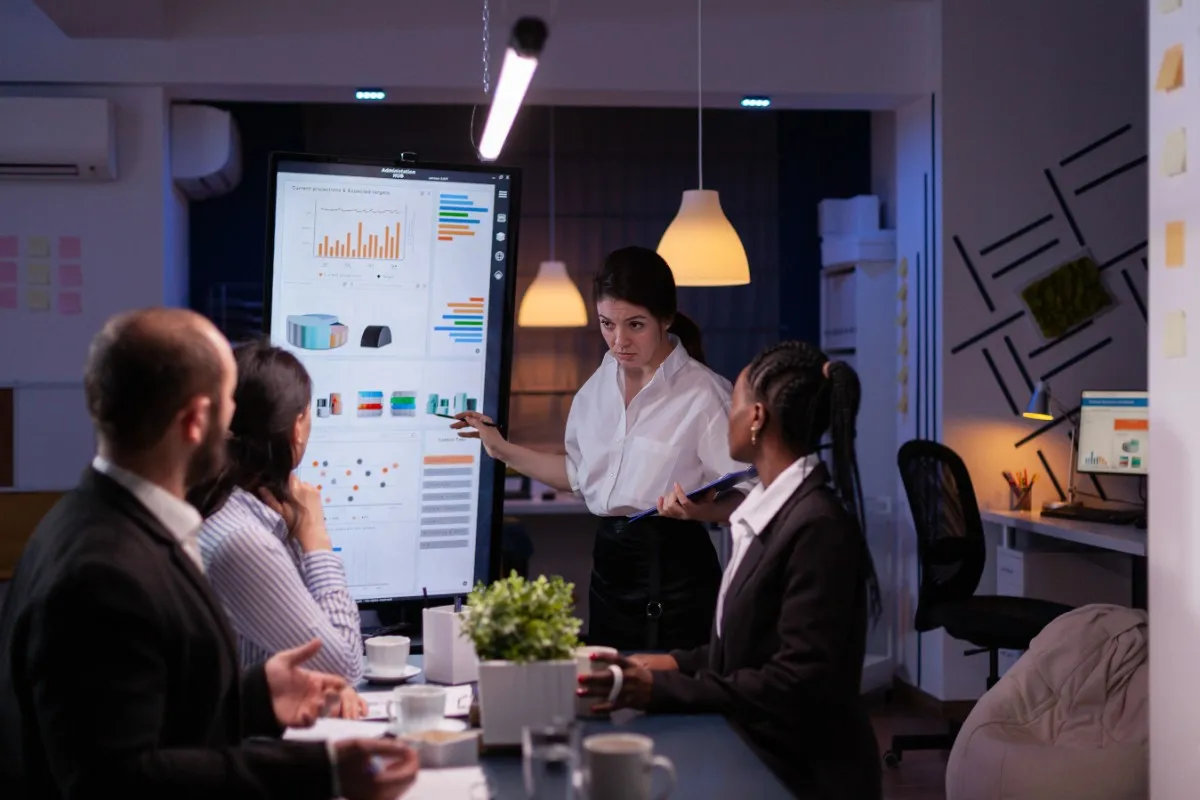 Professional engineers attending a UPDA/MMUP Certification courses in Doha, Qatar, analyzing technical reports and performance charts.