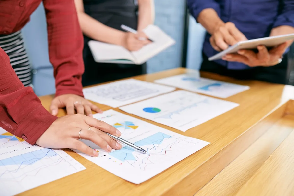 PMP vs CAPM vs PMI-RMP certification in Qatar comparison with professionals analyzing project reports