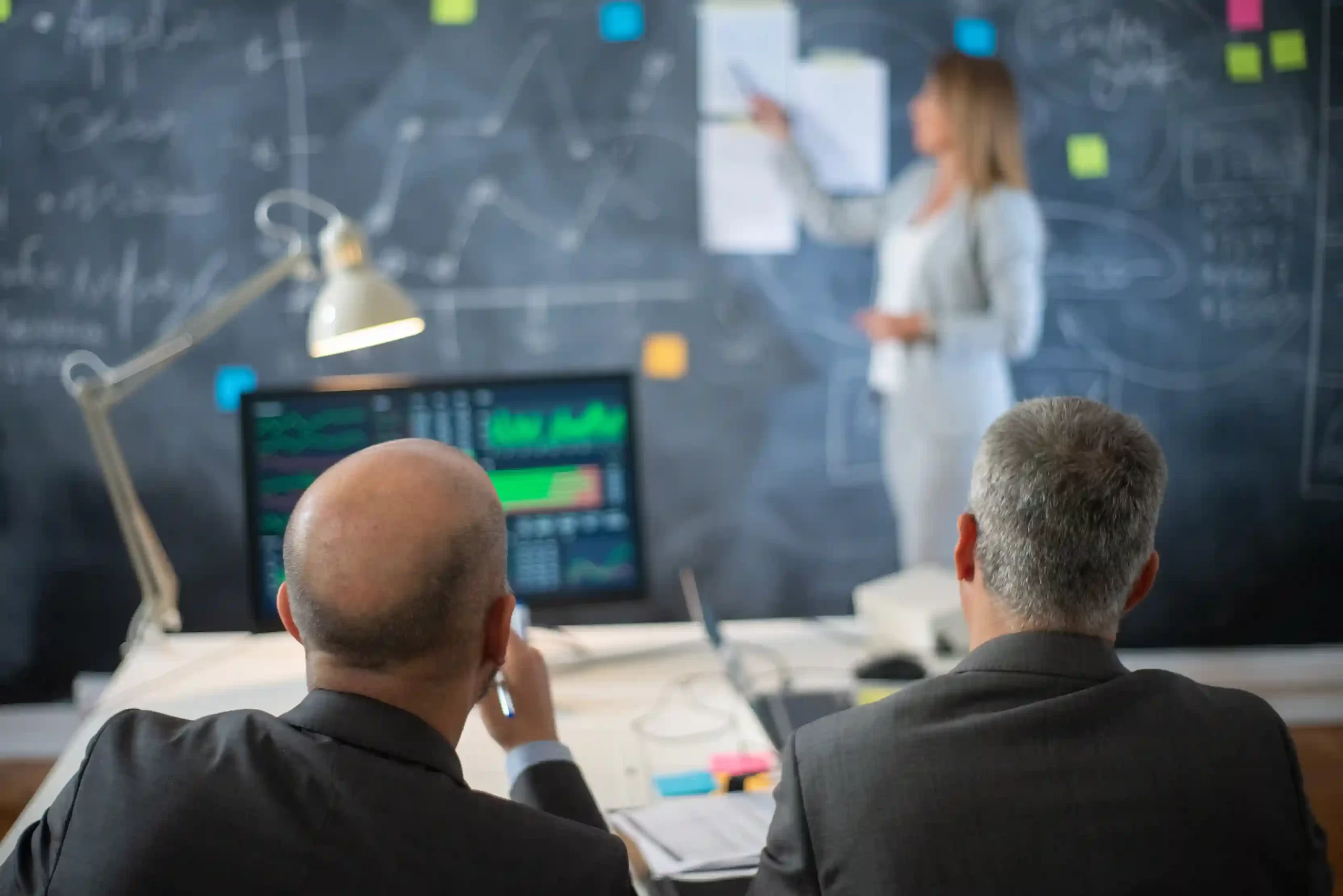 Best CMA certification in Qatar with finance professionals reviewing business analytics
